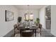 Formal dining room with a long wood table and elegant chandelier at 326 Fuente Dr, Henderson, NV 89014