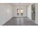 Open dining area features wood floors, modern lighting, and access to outdoor area at 326 Fuente Dr, Henderson, NV 89014