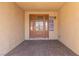 Covered front porch with tiled floor and beautiful front door at 326 Fuente Dr, Henderson, NV 89014