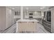 Spacious open kitchen with stainless appliances, island seating, and custom cabinetry at 326 Fuente Dr, Henderson, NV 89014