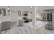 Modern kitchen featuring stainless steel appliances, an island, and gray cabinetry at 326 Fuente Dr, Henderson, NV 89014