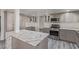 Modern kitchen featuring stainless appliances, island seating, and custom cabinetry at 326 Fuente Dr, Henderson, NV 89014