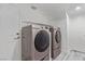 Convenient laundry room featuring modern front-loading washer and dryer and storage space at 326 Fuente Dr, Henderson, NV 89014