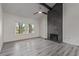 Bright living room featuring a floor-to-ceiling fireplace at 326 Fuente Dr, Henderson, NV 89014