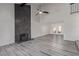 Open-concept living room with a fireplace and access to the dining area at 326 Fuente Dr, Henderson, NV 89014