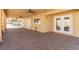 Covered outdoor patio featuring brick pavers and outdoor ceiling fans at 326 Fuente Dr, Henderson, NV 89014