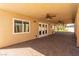 Covered outdoor patio featuring brick pavers and outdoor ceiling fans at 326 Fuente Dr, Henderson, NV 89014