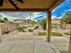 Cozy outdoor living space featuring a covered patio and a well-maintained backyard at 3624 Pelican Brief Ln, North Las Vegas, NV 89084