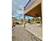 A view of a backyard area showing patio, desert landscaping, pavers, and an exterior view of the home at 3624 Pelican Brief Ln, North Las Vegas, NV 89084