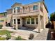 A fully fenced backyard with a covered patio, a balcony, and low-maintenance landscaping at 3624 Pelican Brief Ln, North Las Vegas, NV 89084