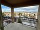 Balcony features iron railings and views of neighborhood homes at 3624 Pelican Brief Ln, North Las Vegas, NV 89084