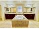 Bathroom with a granite enclosed bath tub and double vanity sinks at 3624 Pelican Brief Ln, North Las Vegas, NV 89084