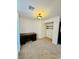 Bedroom with carpeted floors, desk and lighting fixture at 3624 Pelican Brief Ln, North Las Vegas, NV 89084