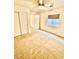 Comfortable bedroom with a ceiling fan, window, and spacious closet space at 3624 Pelican Brief Ln, North Las Vegas, NV 89084