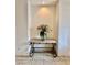 Entrance hall featuring decorated console table with fresh flower centerpiece at 3624 Pelican Brief Ln, North Las Vegas, NV 89084