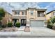 Charming two-story home featuring a covered porch, balcony, and a well-maintained front yard at 3624 Pelican Brief Ln, North Las Vegas, NV 89084