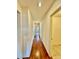 Bright hallway with hardwood floors leading to other rooms in the home at 3624 Pelican Brief Ln, North Las Vegas, NV 89084