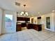 Kitchen with a large island, stainless steel appliances, and tile flooring at 3624 Pelican Brief Ln, North Las Vegas, NV 89084