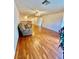Spacious living room featuring hardwood floors, a ceiling fan, and comfortable seating at 3624 Pelican Brief Ln, North Las Vegas, NV 89084