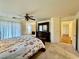 Main bedroom featuring a walk-in closet and neutral carpeting at 3624 Pelican Brief Ln, North Las Vegas, NV 89084