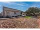 Large backyard with gravel, an artificial lawn, and a stone patio providing ample outdoor space at 3713 Nairobi Ln, North Las Vegas, NV 89032