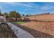 Spacious backyard featuring low-maintenance landscaping and a well-defined boundary for privacy at 3713 Nairobi Ln, North Las Vegas, NV 89032