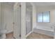 Bright bathroom features a walk-in shower, soaking tub, and classic fixtures at 3713 Nairobi Ln, North Las Vegas, NV 89032