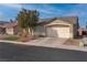 Charming single-story home with a two-car garage and a small, tidy front lawn at 3713 Nairobi Ln, North Las Vegas, NV 89032