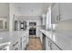 Modern kitchen with white cabinets, island, and stainless steel appliances at 3713 Nairobi Ln, North Las Vegas, NV 89032