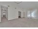 Spacious living room with high ceilings, neutral paint, and lots of natural light from the sheer-curtained window at 3713 Nairobi Ln, North Las Vegas, NV 89032