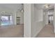 Open living room with access to the backyard and multiple access points at 3713 Nairobi Ln, North Las Vegas, NV 89032
