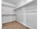 Functional walk-in closet with ample shelving and neutral carpet, providing organized storage at 3713 Nairobi Ln, North Las Vegas, NV 89032