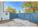 Private backyard patio with blue wooden fence, offering a serene outdoor retreat at 4078 Gold Coast Dr, Las Vegas, NV 89121