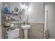 Charming half-bathroom with pedestal sink and decorative tile accents at 4078 Gold Coast Dr, Las Vegas, NV 89121