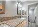 Bathroom with granite countertops, white cabinets, and a view leading to the stairway at 4078 Gold Coast Dr, Las Vegas, NV 89121