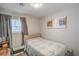 Cozy bedroom with a twin bed, window, and serene decor at 4078 Gold Coast Dr, Las Vegas, NV 89121
