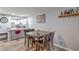 Cozy dining area featuring a wooden table set, adjacent to the kitchen and granite countertops at 4078 Gold Coast Dr, Las Vegas, NV 89121