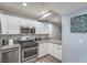 Image of kitchen with stainless appliances, granite, white cabinets at 4078 Gold Coast Dr, Las Vegas, NV 89121