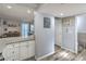 Kitchen with granite counter tops leading to the dining and living room area at 4078 Gold Coast Dr, Las Vegas, NV 89121