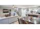 A combined living and dining area with stairs leading to the second floor at 4078 Gold Coast Dr, Las Vegas, NV 89121