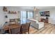 Large living room with dining table, TV, and comfortable seating arrangement at 4078 Gold Coast Dr, Las Vegas, NV 89121