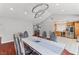Dining area features modern light fixtures, hard wood floor and an open view to the kitchen at 4115 Ridgewood Ave, Las Vegas, NV 89120
