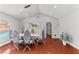 Dining area features a modern table set, hardwood flooring, and sophisticated decor at 4115 Ridgewood Ave, Las Vegas, NV 89120