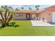 Single-story home with well-maintained front yard and covered porch at 4115 Ridgewood Ave, Las Vegas, NV 89120