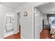 Hallway featuring hardwood floors, neutral walls, and access to various rooms at 4115 Ridgewood Ave, Las Vegas, NV 89120
