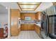 Bright kitchen with wood cabinets, white countertops, and modern appliances at 4115 Ridgewood Ave, Las Vegas, NV 89120
