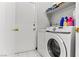 Laundry room featuring a washing machine, dryer, and storage shelves at 4115 Ridgewood Ave, Las Vegas, NV 89120