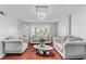Bright living room featuring hardwood floors, modern decor, and decorative chandelier at 4115 Ridgewood Ave, Las Vegas, NV 89120