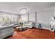 Bright living room featuring hardwood floors, stylish sofas, and decorative lighting at 4115 Ridgewood Ave, Las Vegas, NV 89120