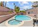 Backyard pool and spa with brick-lined landscaping, perfect for relaxation and entertainment at 4115 Ridgewood Ave, Las Vegas, NV 89120